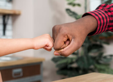 black-father-son-bumping-fists